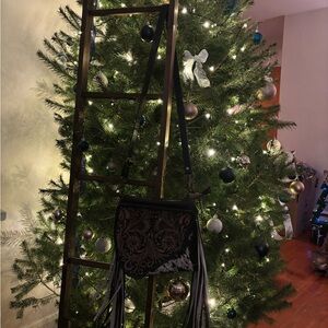 Myra cowhide fringe purse